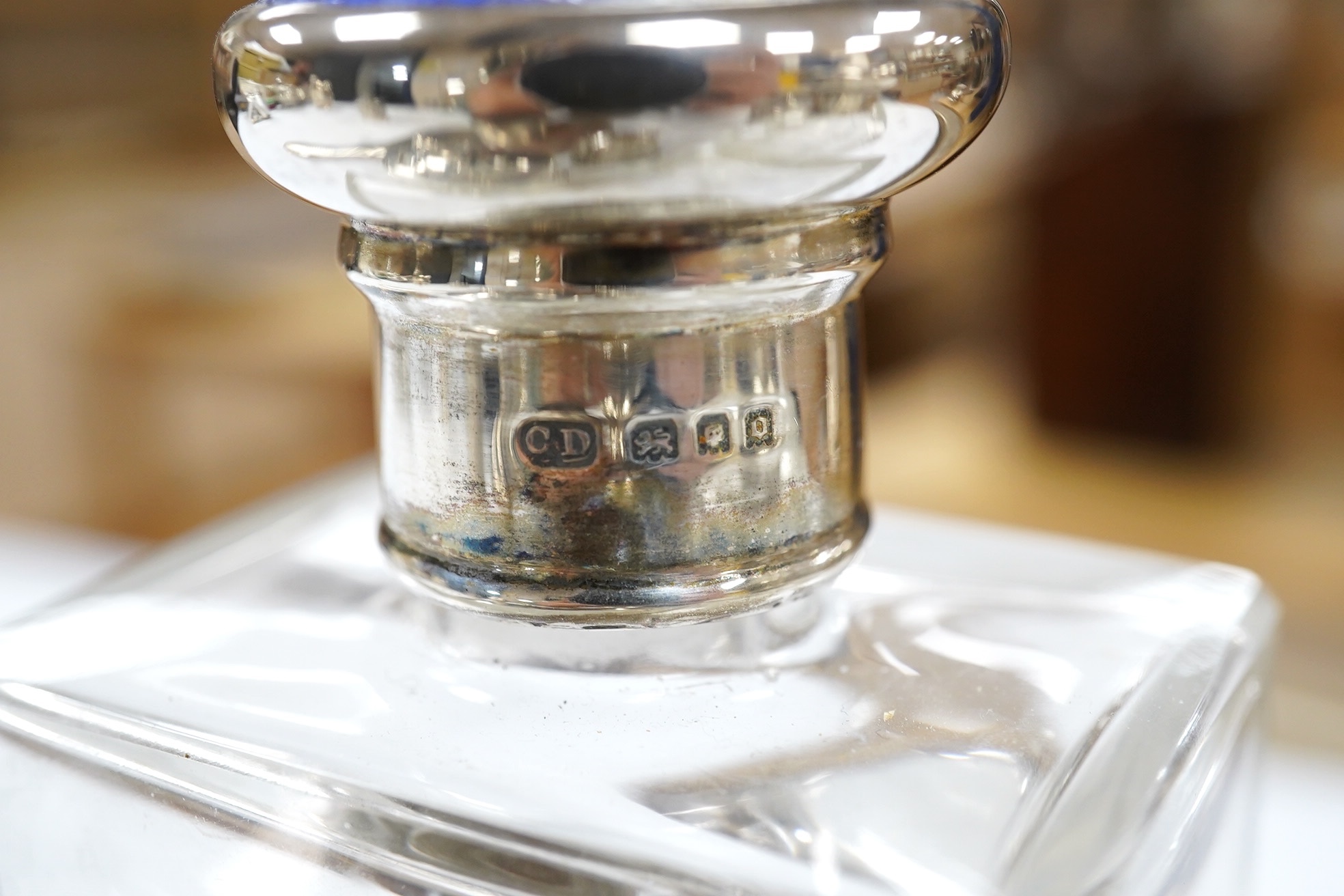 Small silver including a napkin ring, hand mirror and two mounted glass toilet jars, together with three Indian white metal condiments and a French white metal wine taster. Condition - poor to fair